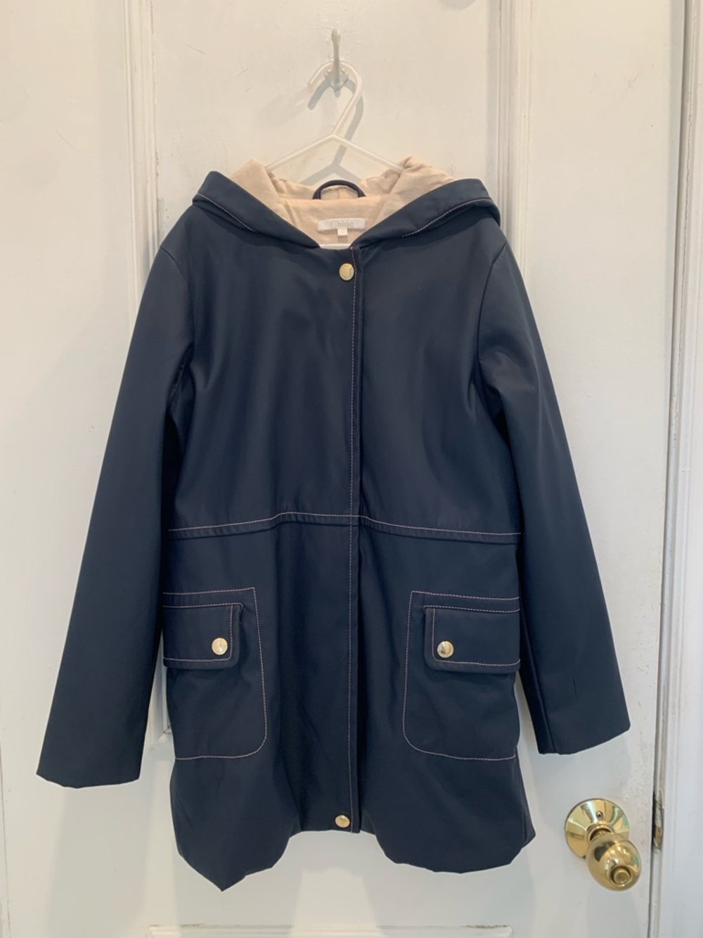 Chloe girl’s navy hooded rain jacket. Size 10